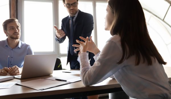 Proposing,Good,Plan.,Inspired,Young,Female,Employee,Sitting,On,Briefing