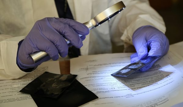 A,Magnifying,Glass,For,Observing,Fingerprints,During,The,Work,Of